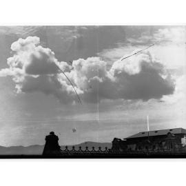 Clouds above rooftops - no information recorded