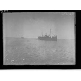 Picture of a ship and another boat in background 