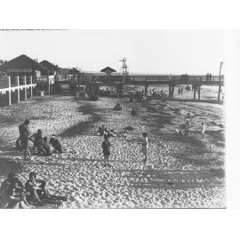 Henley Beach showing children and adults sunbathing on beach