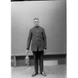 Porter demonstrating railway lantern signals