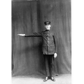 Porter demonstrating railway hand signals