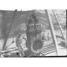Happy Valley Waterworks - man standing next to piece of equipment