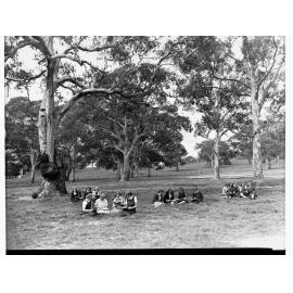 Girls on Oval Reading at Oakbank Area School