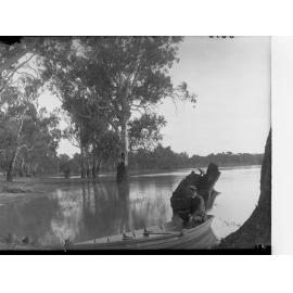 Man in rowboat on River Murray