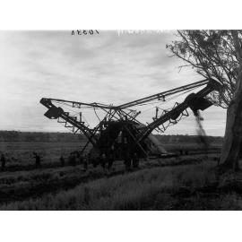 Machine digging irrigation channel from River Murray