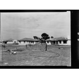 Port Pirie - man watering plants on reserve