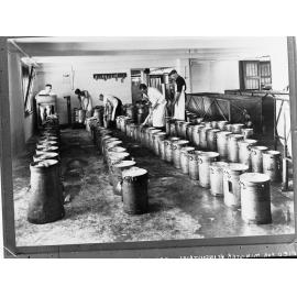 Dairy factory testing cream, five men at work