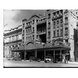 Bowman building King William Street decorated for State centenary, automobiles parked outside building