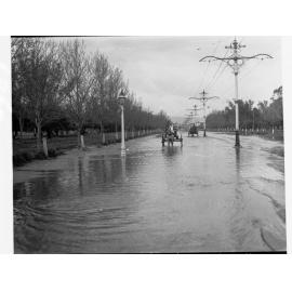 View of flooding in Unley Road  - two carts pulled by horses in middle of road