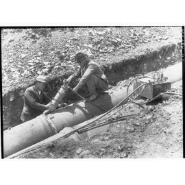 Men fixing pipeline, Darlington