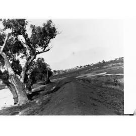 Mound of Dirt Next to River Murray Showing Town in the Distance