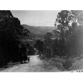 Horse Drawn Carriage on a Road Showing View of Highbury in the Background