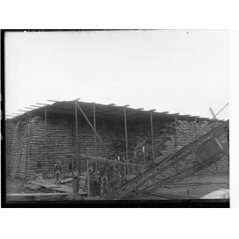 Men loading wheat sacks at Flour Mill Port Adelaide 