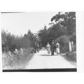 Men and women walking along road in Stirling