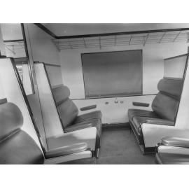 Railway carriage interior showing seats , number 55