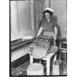 Woman egg pulping at Farmer's Union