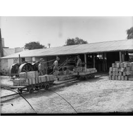 Carrying Fruit from Dip Ready for Drying Renmark