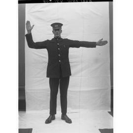 Porter demonstrating railway hand signals