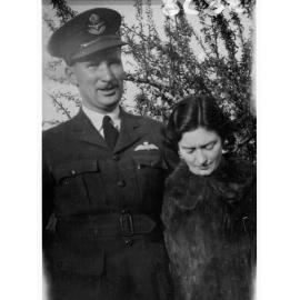 Portrait of an officer in Royal Australian Air Force - photo copied for Roll of Honour (lady is also in photograph))