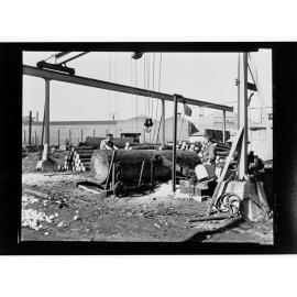 S.A. Plywoods - machine being used to lift logs