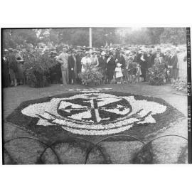 Victoria Square showing a crowd of people gathered around a floral display, Flower Day