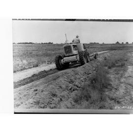 Man on harvesting machine