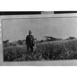 Man Standing in Thick Undergrowth