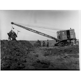 Excavator working for sewers department at Dry Creek