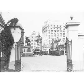 View towards King William Street from Government House gates - shows South Africal (Boer) War Memorial and trams on King William Street