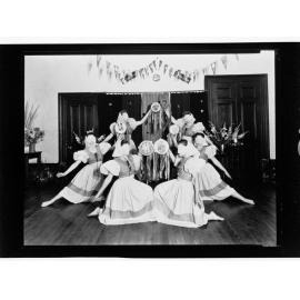 Children's Welfare Department - young women dancing in costume with masks