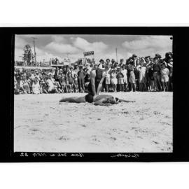 Brighton - group watching lifesaving demonstration