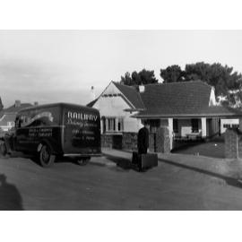 Railway Delivery Service Van Outside a House Man Carrying Suitcases