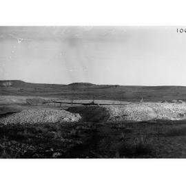 Parliamentary party on tour of Far North in Austin cars (government cars) - shows small mine, possibly Oodnadatta