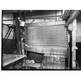 Egg pulping at national company, man by machine