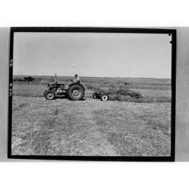 Man on tractor ploughing field