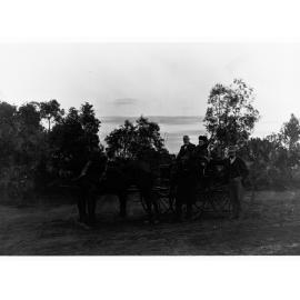 Men and a Women by a Horse Drawn Carriage