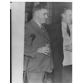 Two men holding beers