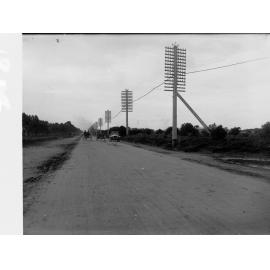 Port Adelaide Road with vehicles and telegraph poles