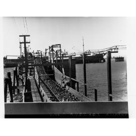 Whyalla - showing conveyer belt carrying iron ore and ship berthed at Jetty.