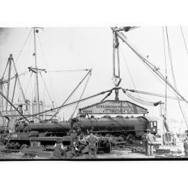 Unloading new railways engines from ship SS Beldis (SAR 600 Class Locomotive)