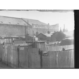 Backyards of houses in Sydney Place. The houses faced Carrington Street.|Factory owned by F Humphris & Sons Ltd., Carrington Street.