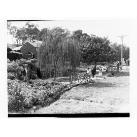 Men and women in a garden at Stirling
