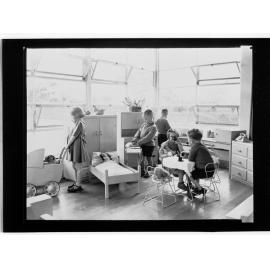 Children's Welfare Department - children in home corner of playroom