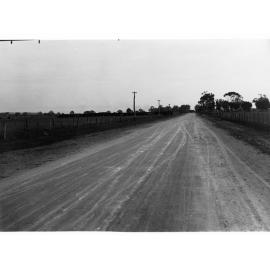 Road Showing Paddocks and Farms
