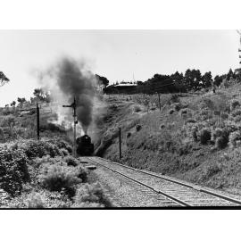 Railway  locomotive on track through countryside