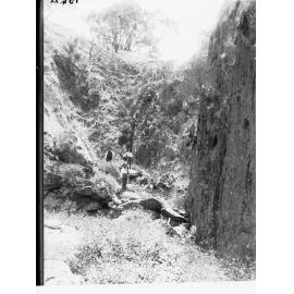 Granite Island Men Standing on Rocks