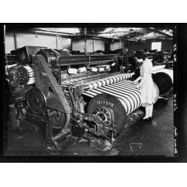 Davies Coop - factory worker using equipment