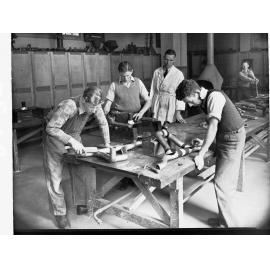 Students Working in Sheet Metalwork Room With Copper Piping