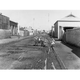Group of working class children standing in Hocking Street  Brompton 