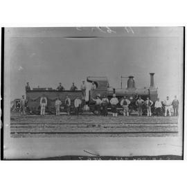 Steam locomotive showing employees